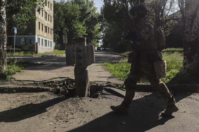 A Ukrainian soldier walks past a part of a rocket near the front line in the city of Severodonetsk, Luhansk region, on June 2. The family of a former U.S. Army veteran confirmed his death in Ukraine in an obituary, becoming the second American killed there. Photo by EPA-EFE