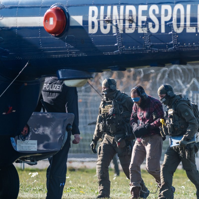 German Federal Police escort Mounir el Motassadeq (C) to a helicopter in Hamburg, Germany, on Monday. Photo by Jens Schlueter/EPA-EFE