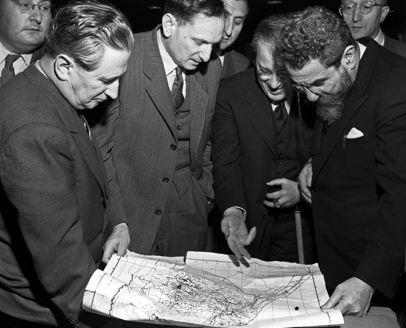 Members of the Jewish Agency delegation, Nahum Goldman, David Horovitz, Emanuel Neumann and Rabbi Wolf Gold, study a map of proposed partition of Palestine at United Nations interim headquarters on November 12, 1947. On November 29, 1947, the United Nations voted for the partition of Palestine and the creation of the independent Jewish state of Israel. File Photo courtesy of the United Nations