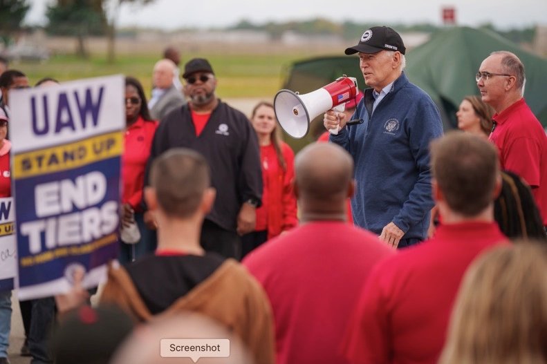 President Joe Biden walked the auto workers' picket line at the General Motors Willow Run Redistribution Center in Belleville, Mich., on Tuesday. Biden walked the line with United Auto Workers President Shawn Fain (R) as the union remained in contract negotiations with Ford, General Motors and Stellantis. Photo courtesy White House X account