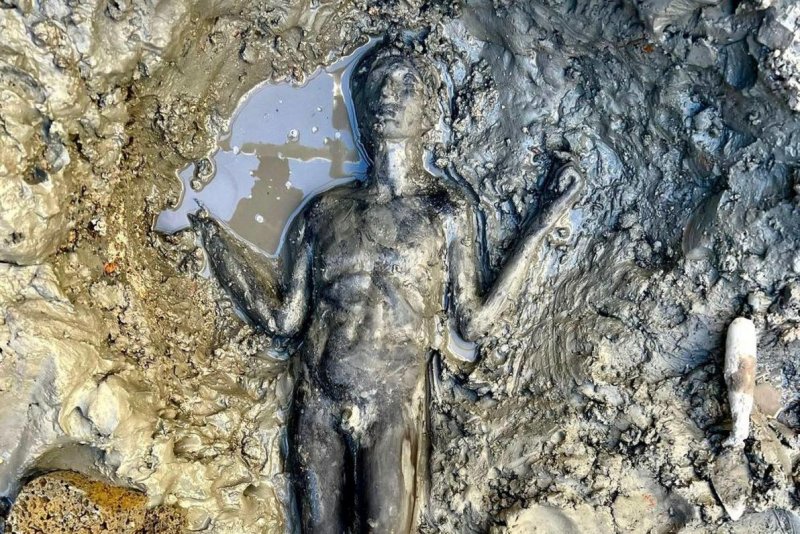 One of the 24 bronze statues of the Roman Etruscan age discovered in San Casciano dei Bagni, near Siena, Italy. The statues depict gods, matrons, children and emperors. Protected for 2,300 years by the mud and boiling water of the sacred tanks, the votive deposit has re-emerged from the excavations in Tuscany. Photo courtesy of Italian Ministry of Culture/ANSA/EPA-EFE