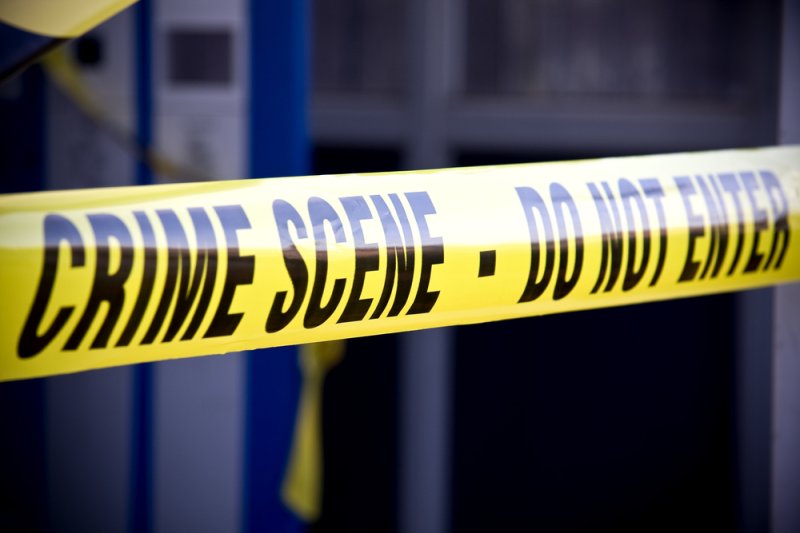 Close up crime scene investigation police boundary tape. Baltimore city police said dozens of people were shot, nine fatally, over the Memorial Day weekend. It has been the deadliest May since 1999. Photo by Brian A Jackson/Shutterstock