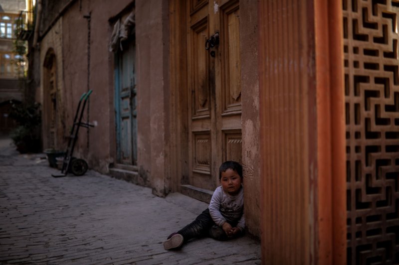 A child is seen in Kashgar in western China's Xinjiang Uyghur Autonomous Region on April 19. File Photo by Wu Hong/EPA-EFE