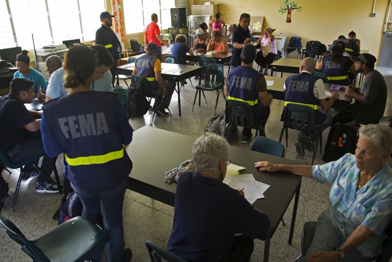 Federal Emergency Management Agency staff members assist survivors of Hurricane Maria in Santa Isabel, Puerto Rico, on October 2, 2017. File Photo by Yuisa Rios/FEMA