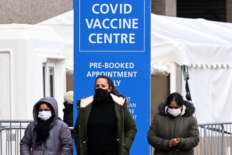 People arrive at a COVID-19 vaccination center in London on Wednesday. About 16 million people across Britain have been vaccinated. Britain has the fifth-most deaths in the nation. Photo by Andy Rain/EPA/EFE