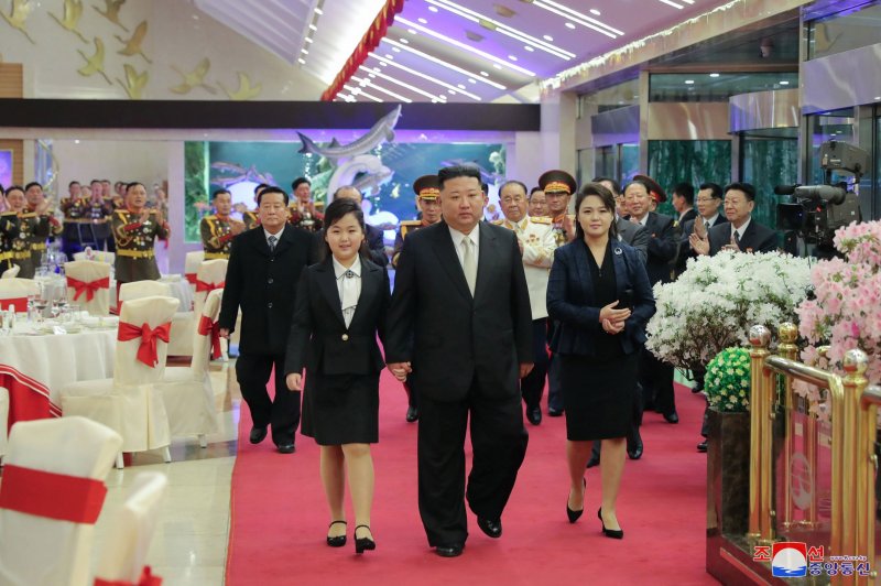 North Korean leader Kim Jong Un (C), his wife Ri Sol Ju (C-R) and his daughter Kim Jue Ae (C-L) attended a banquet celebrating the 75th founding anniversary of the Korean People’s Army, state media reported Wedensday. Photo by KCNA/EPA-EFE
