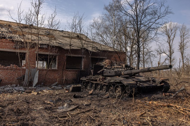 Abandoned Russian tank in front of abandoned house. 