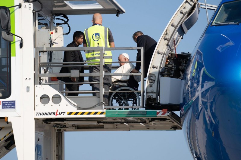 Pope Francis is lifted aboard the airplane at Leonardo Da Vinci Airport in Fiumicino, Italy, that will take him to Canada to apologize for the Roman Catholic Church’s role in the abuse of indigenous children on Sunday. The five-days visit is the first papal visit to Canada in 20 years. Photo by Redazione Telenews/EPA-EFE