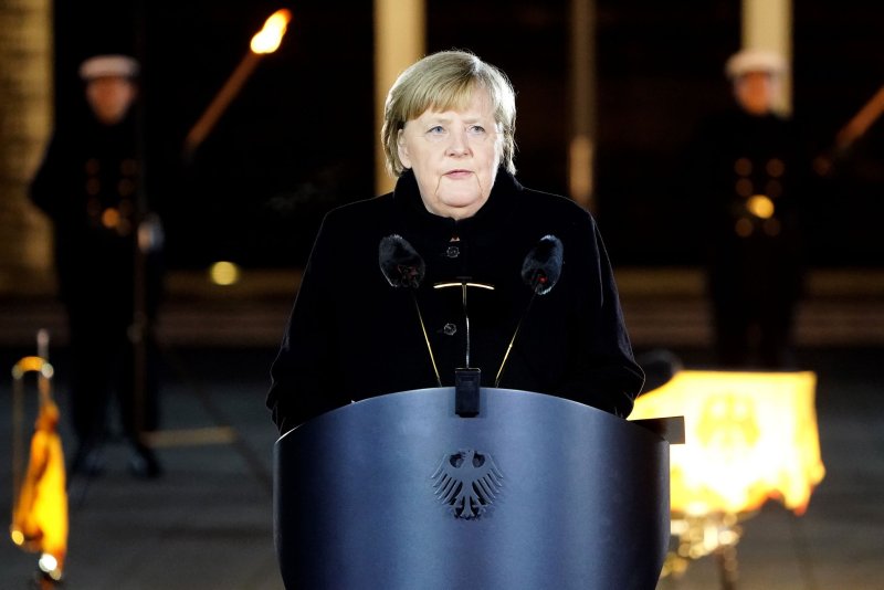 Merkel urges Germans to defend democratic values at farewell parade