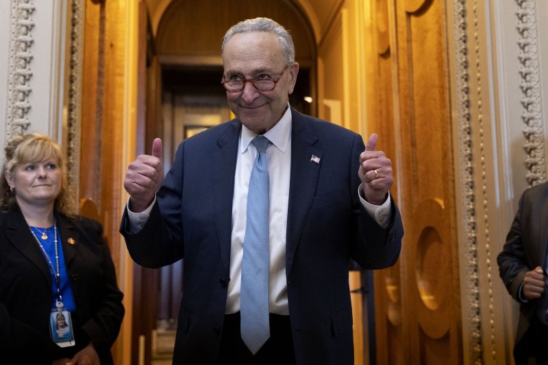 Senate Majority Leader Chuck Schumer gestures as he walks off the Senate floor after the Senate passed the Inflation Reduction Act during a marathon voting session known as a 'vote-a-rama' on Capitol Hill on Sunday. Photo by Michael Reynolds/EPA-EFE