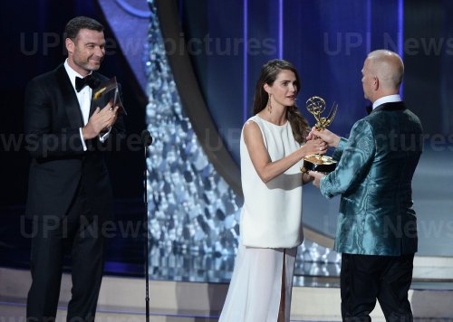 Liev Schreiber, Keri Russell and Ryan Murphy onstage at the 68th Primetime Emmy Awards in Los Angeles