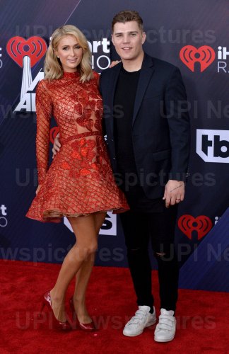 Paris Hilton and Chris Zylka attend the iHeartRadio Music Awards in Inglewood, California